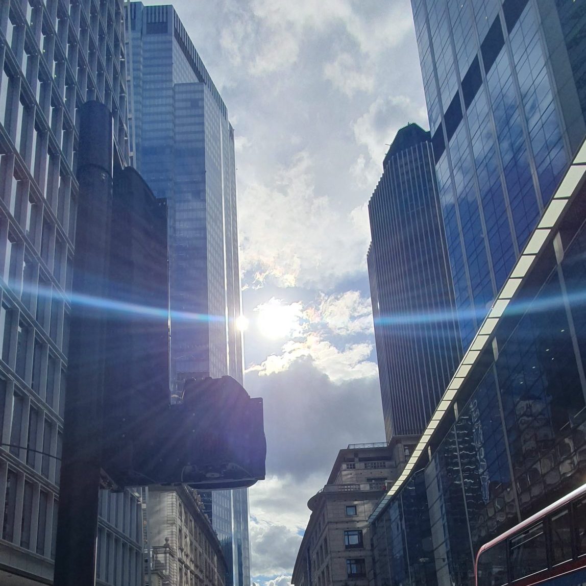 The sun shines down Bishopsgate, London.