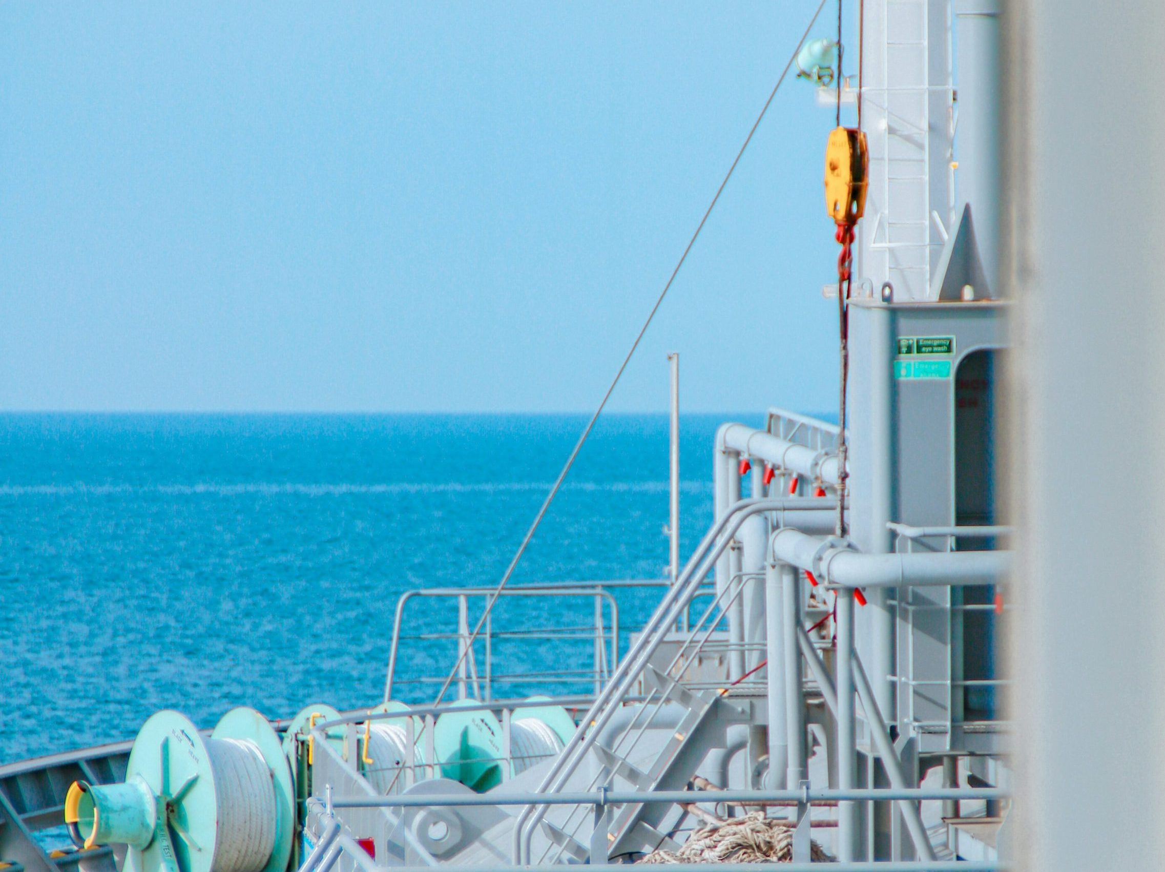 A ship sails toward the horizon