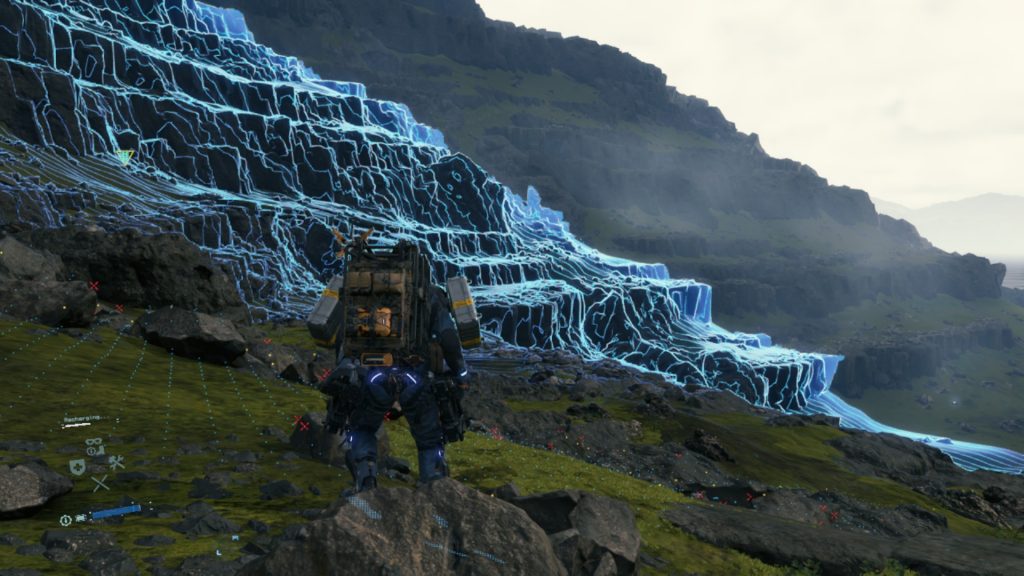 A blue scanning wave moves away from the player character, highlighting the various ridges of the volcanic landscape ahead.