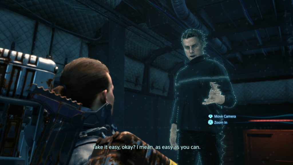 The player character speaks to a hologram resembling Geoff Keighley.